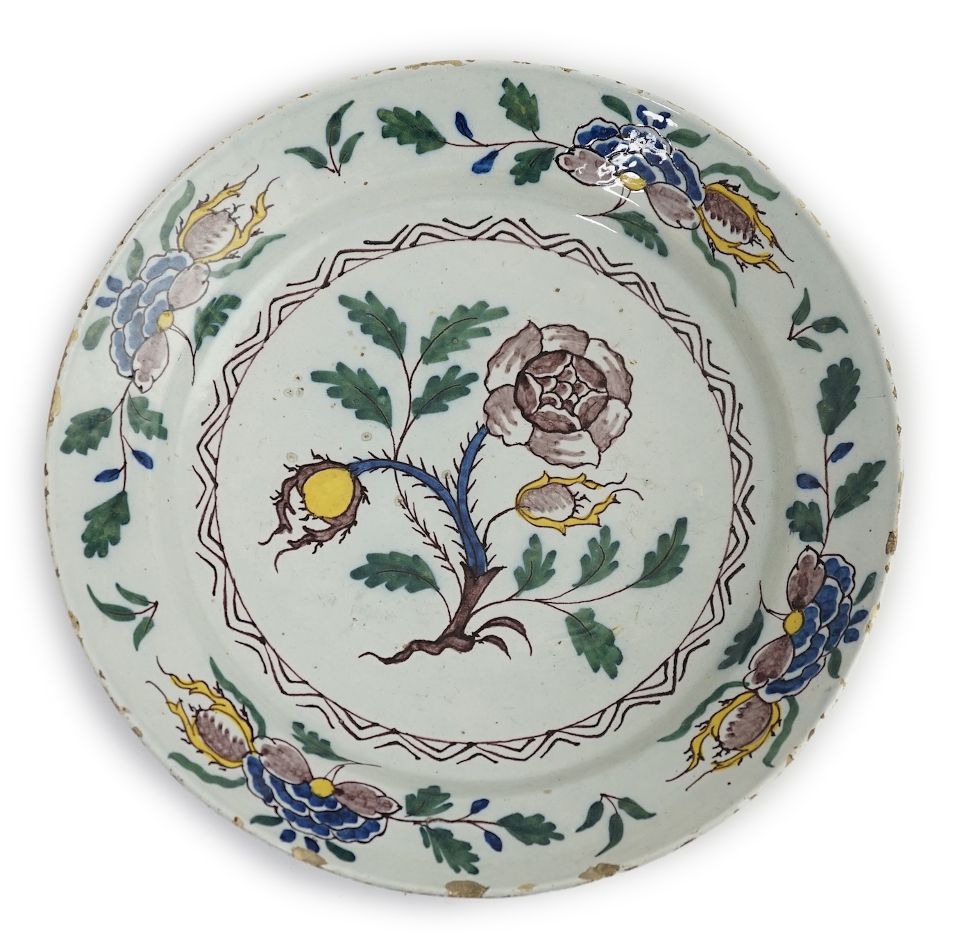 A mid 18th century English polychrome delftware dish